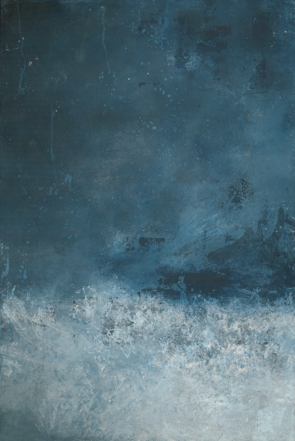 A vinyl photography backdrop with a gradient of deep blue to frothy white, creating a dramatic, artistic look.