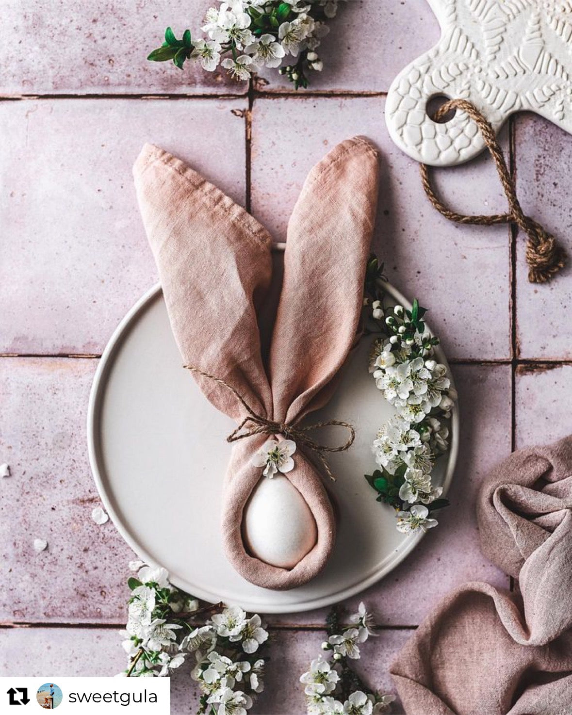 Easter styling on a pink tile-effect vinyl photography backdrop with a vintage chalky tile effect.