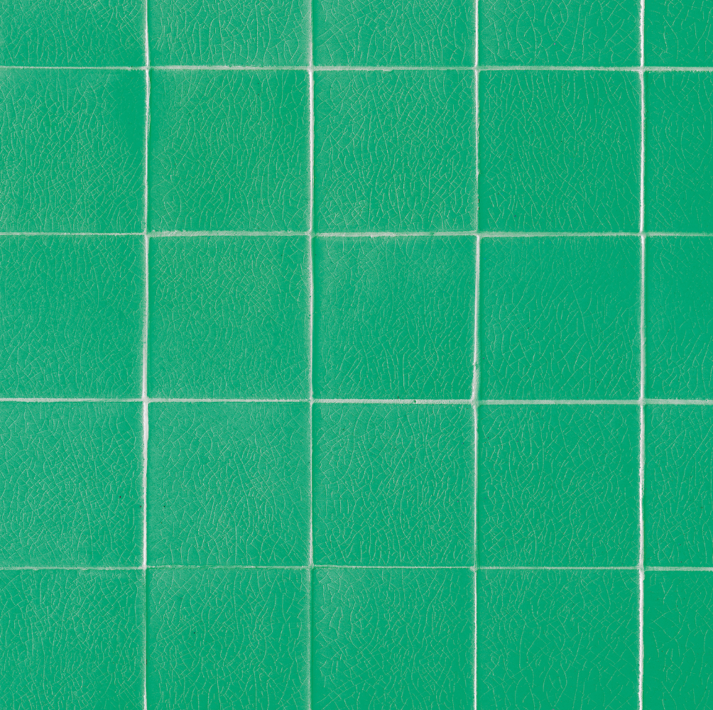 Close up of a jade green vinyl photography backdrop with a crackled vintage tile effect.
