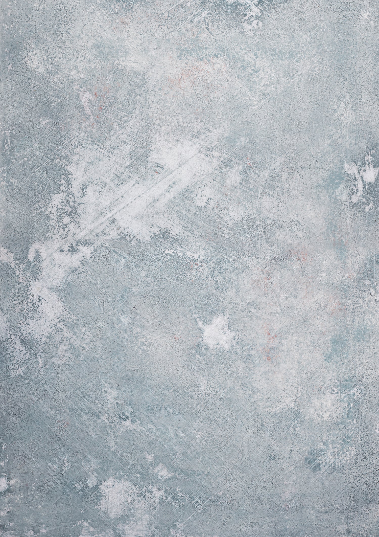 A weathered blue and grey effect hand painted photography backdrop with a variety of colors creating a textured appearance.