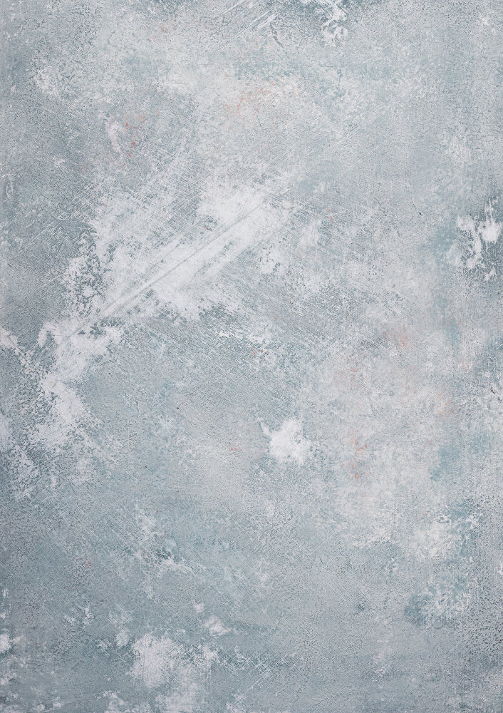 A weathered blue and grey effect hand painted photography backdrop with a variety of colors creating a textured appearance.