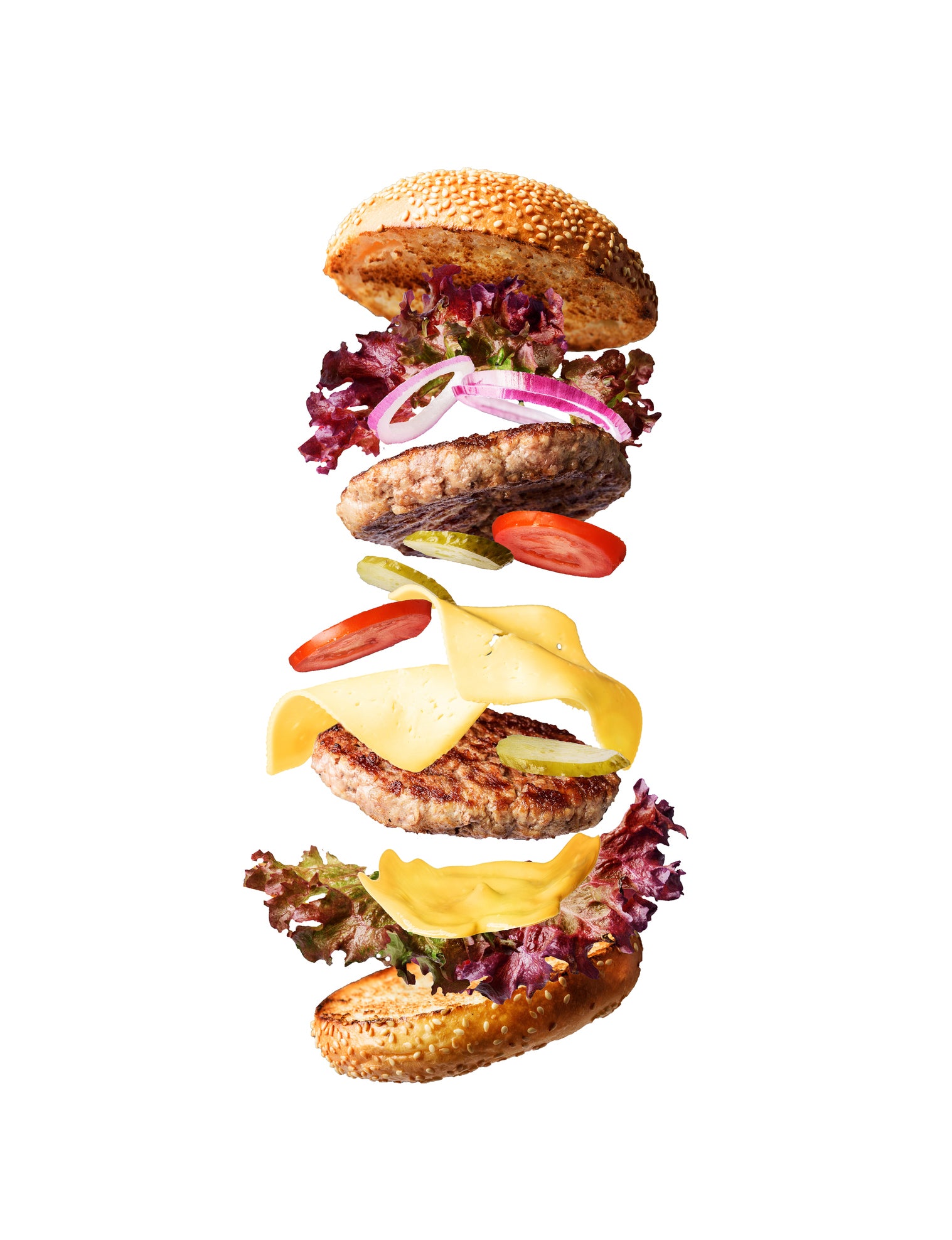 A deconstructed burger styled on a plain white photography backdrop designed for use in studio and ecommerce commercial photography.