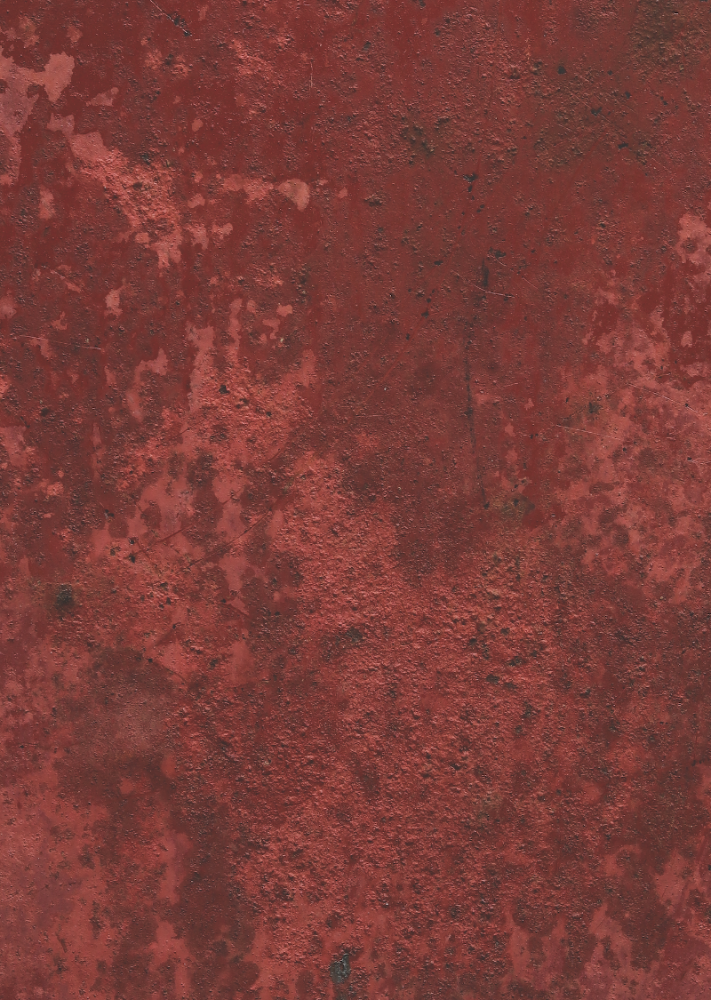 A close-up image of a textured rusty red metal effect photography backdrop used for food and product styling.