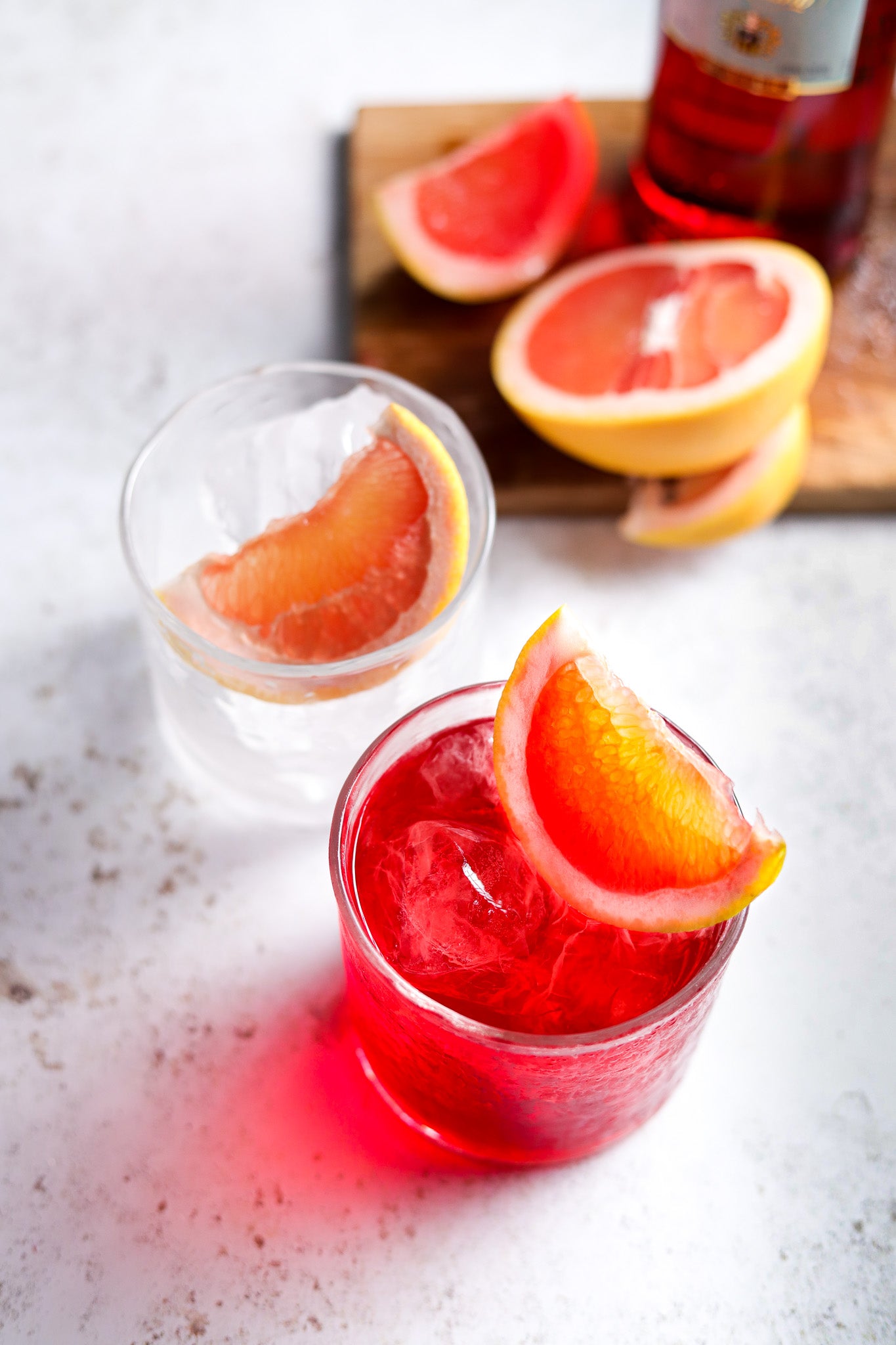 White vinyl photography backdrop with grapefruit cocktails