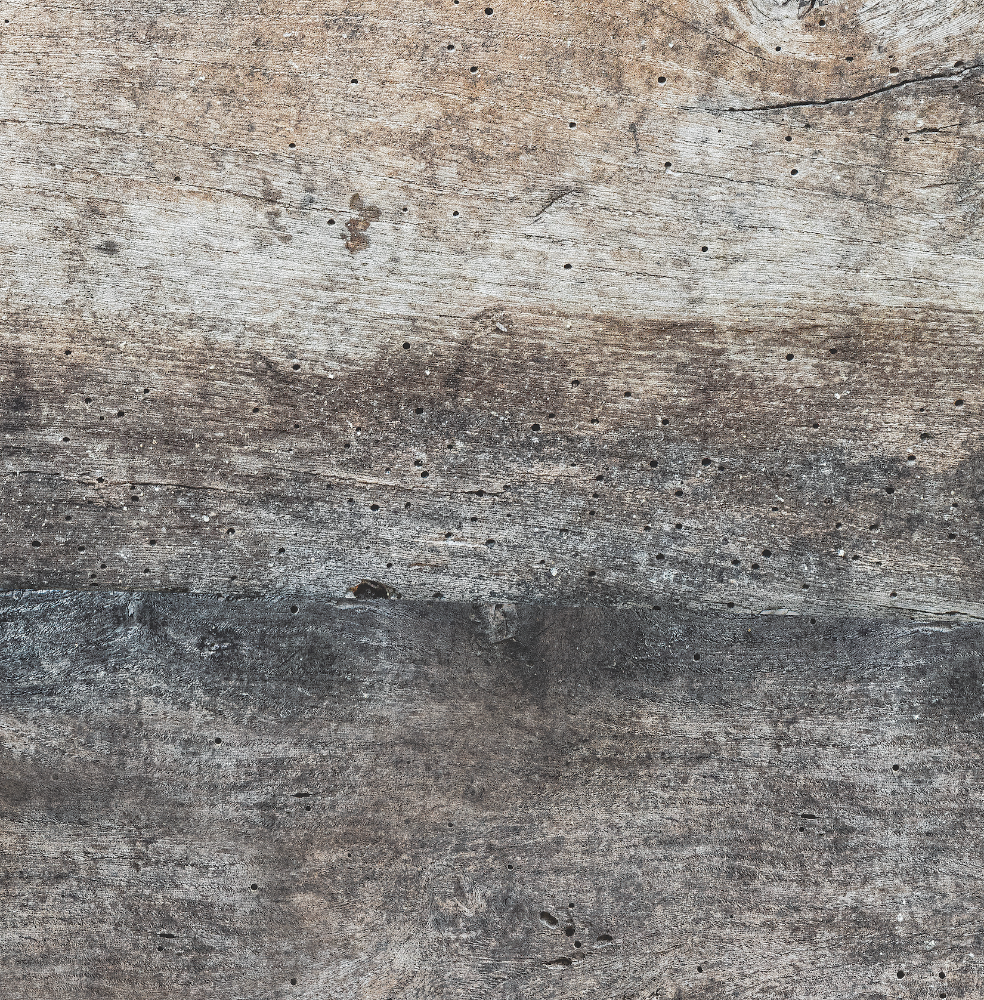 Zoomed view of an old wooden panel effect rustic photography backdrop with a primarily brown and gray color palette, suitable for food and flat lay styling.