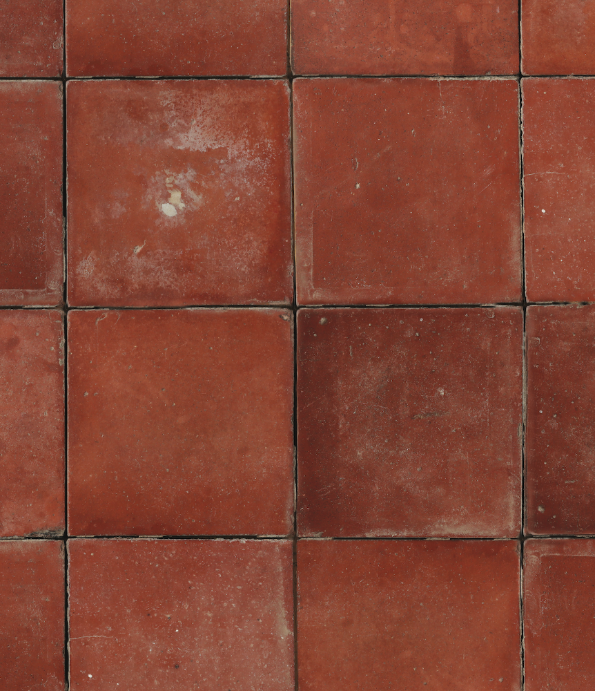 Close up of a terracotta tile effect photography backdrop with an irregular, aged patina.