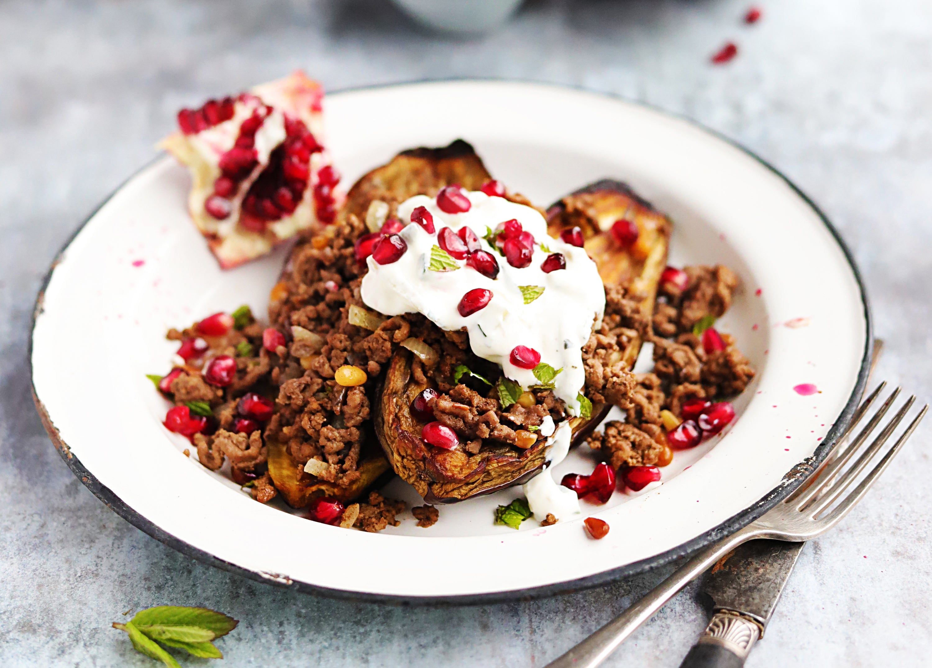 spiced lamb & aubergine, pomegranate, pine nuts