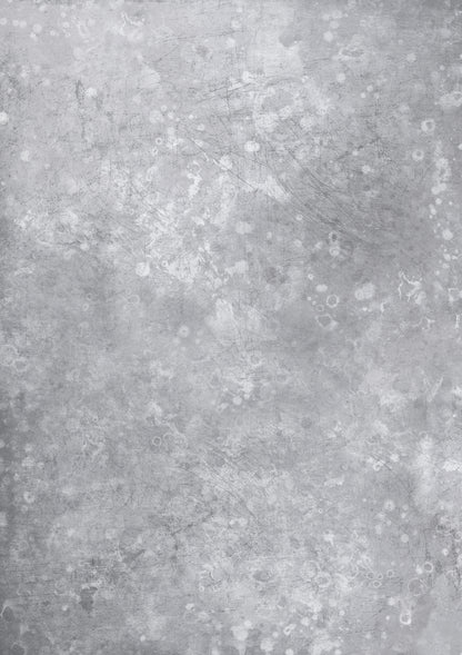 A close-up view of a weathered grey metal effect vinyl photography backdrop with a water-marked texture.