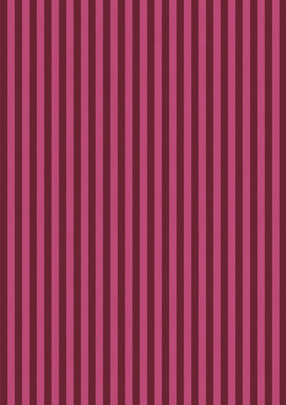 A vinyl photography backdrop with a vertical striped pattern in alternating pink and red designed for food and product photography.