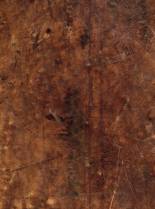 Close-up of a vintage brown leather effect photography backdrop with scratches and other textural details.