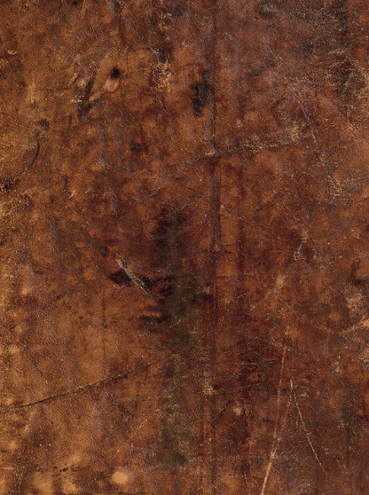 Close-up of a vintage brown leather effect photography backdrop with scratches and other textural details.