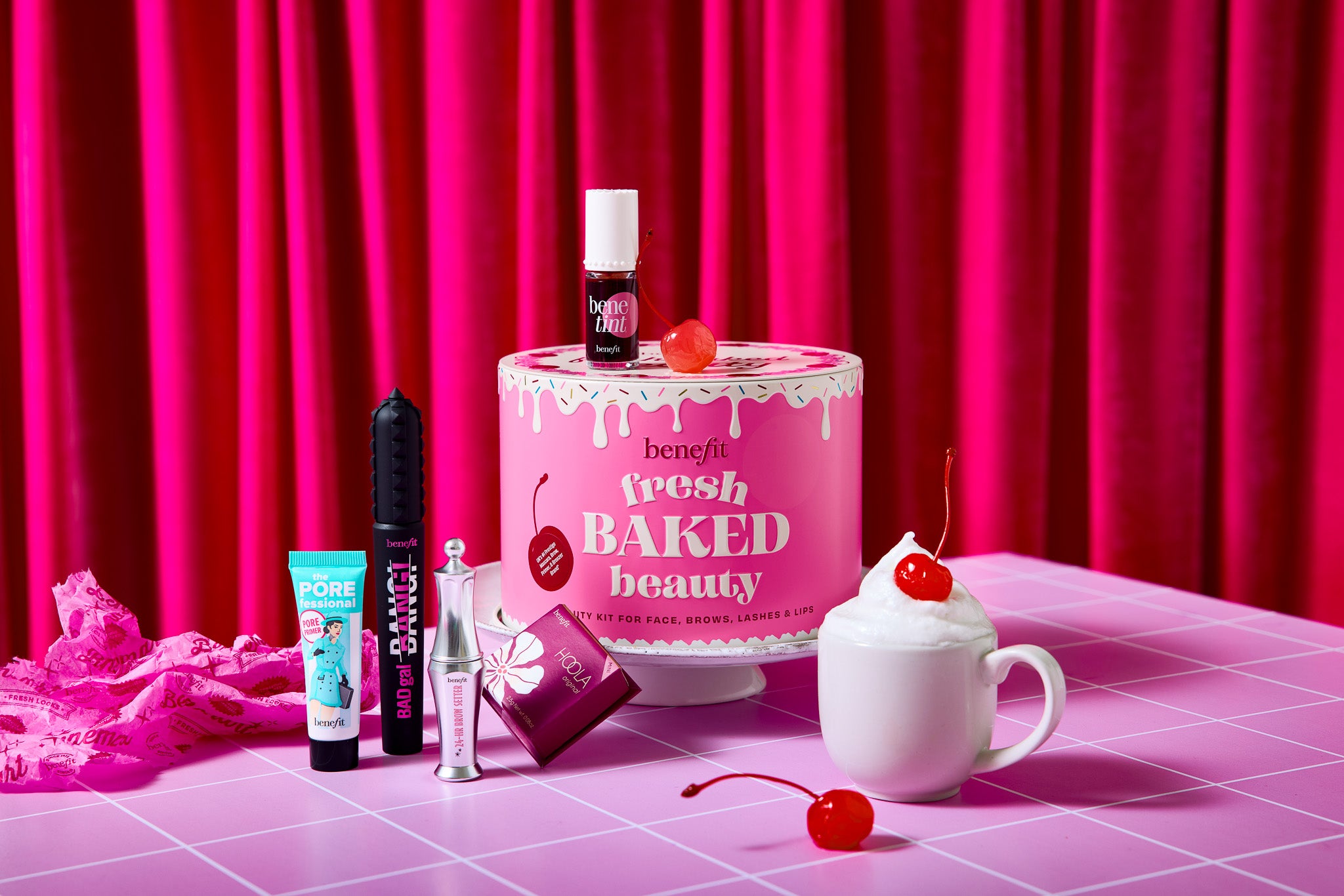 Colourful cosmetics shot on a pink tile graphic effect vinyl photography backdrop for food and product styling.