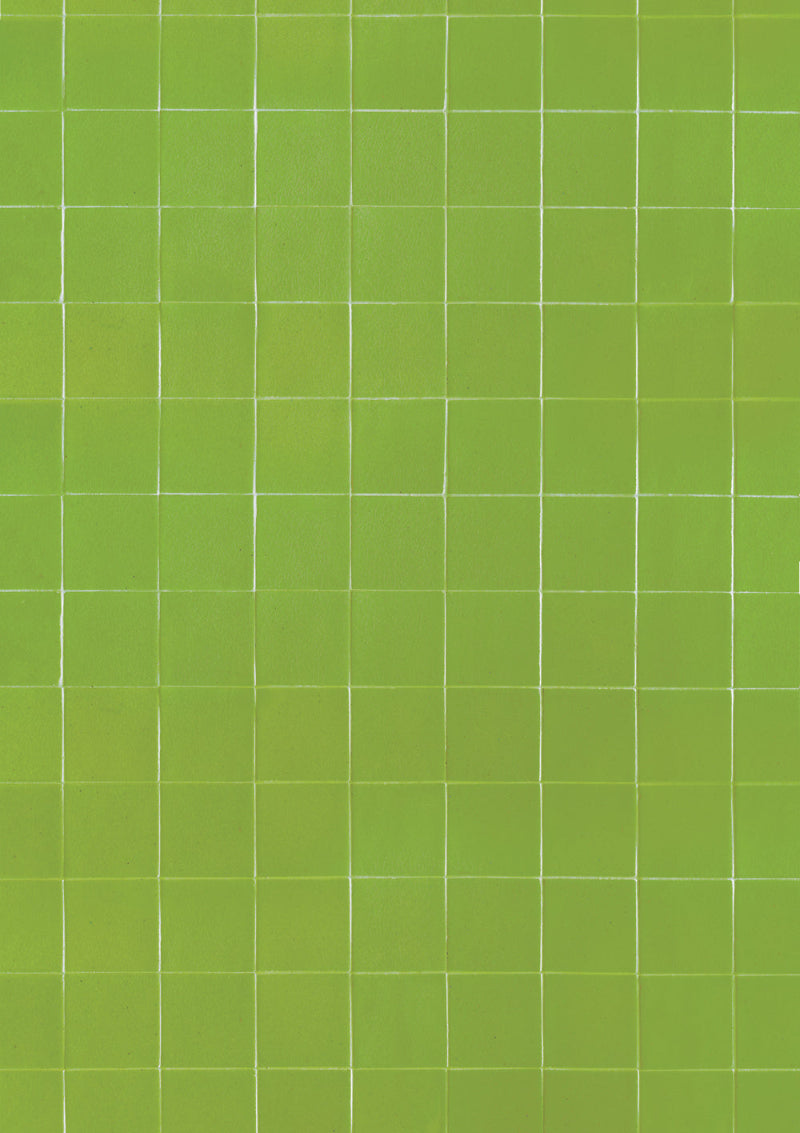 A chartruese tile-effect vinyl backdrop with a grid pattern of square tiles and thin white grout lines for food photography and product photography.