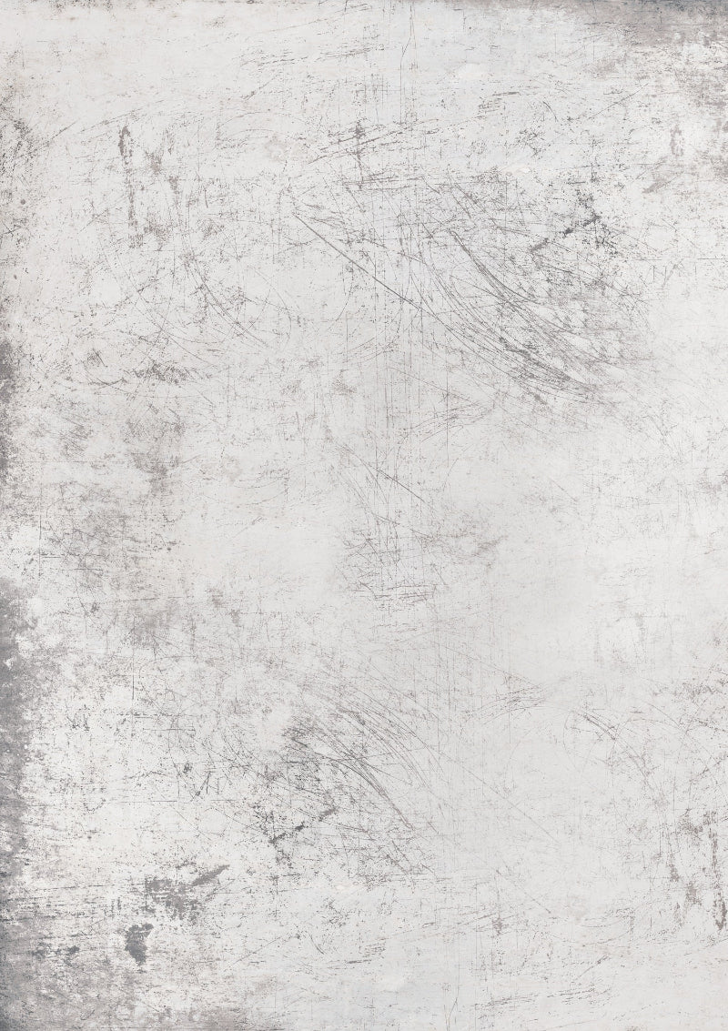 A weathered white photography backdrop with grey flecks and scratches creating a metal-esque patina.