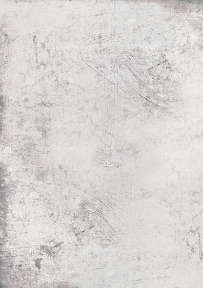 A weathered white photography backdrop with grey flecks and scratches creating a metal-esque patina.