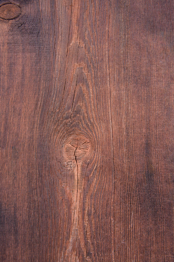 Dark brown wood grain effect photography backdrop with visible knots, natural texture and linear grain patterns.