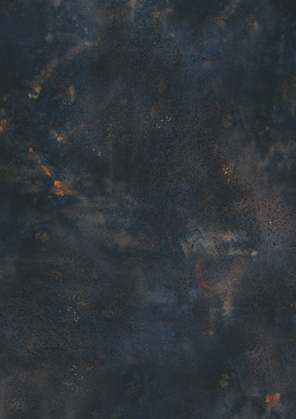 A dark blue vinyl photography backdrop with a warm rust effect showcasing varying shades of navy blue, taupe and rust highlights.