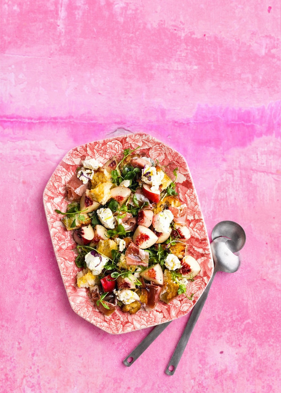 Peach panzanella with toasted ciabatta, jamon iberico and mascarpone; styled on a pink vinyl photography backdrop with a rendered platser wall-effect.