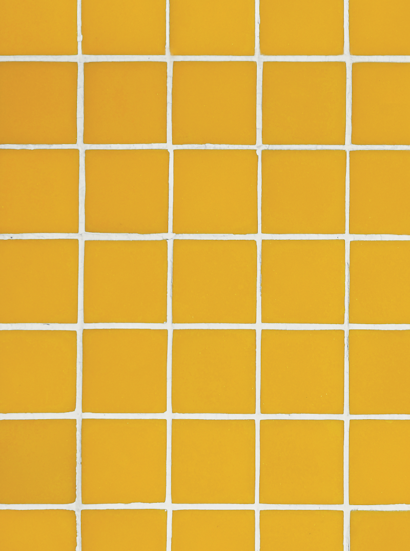 Close up of a yellow tile effect vinyl photography backdrop with white grout lines.