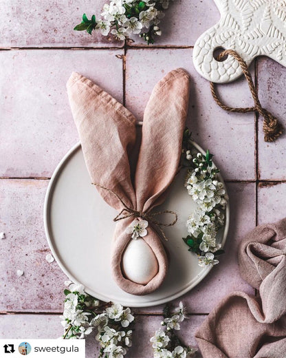 Easter styling on a pink tile-effect vinyl photography backdrop with a vintage chalky tile effect.