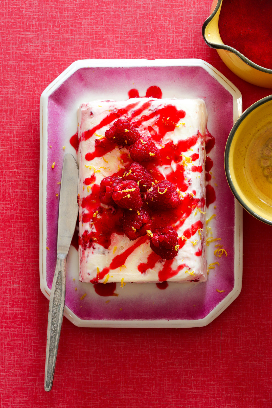 Raspberry desert flat lay on red formica tabletop