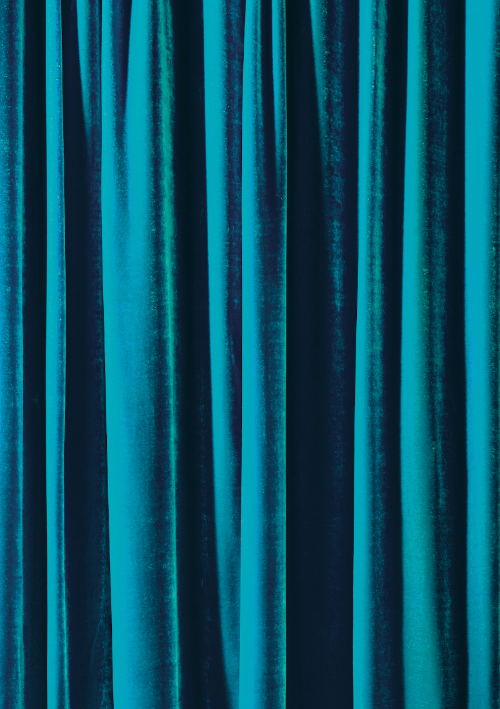 A close-up of peacock blue silk velvet curtain effect photography backdrop for food and product styling.