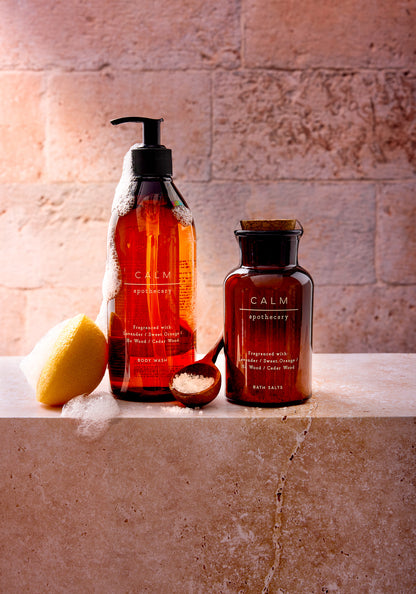 Marks and Spencer Calm apothecary range shot against a beige and grey stone tile-effect vinyl photography backdrop.