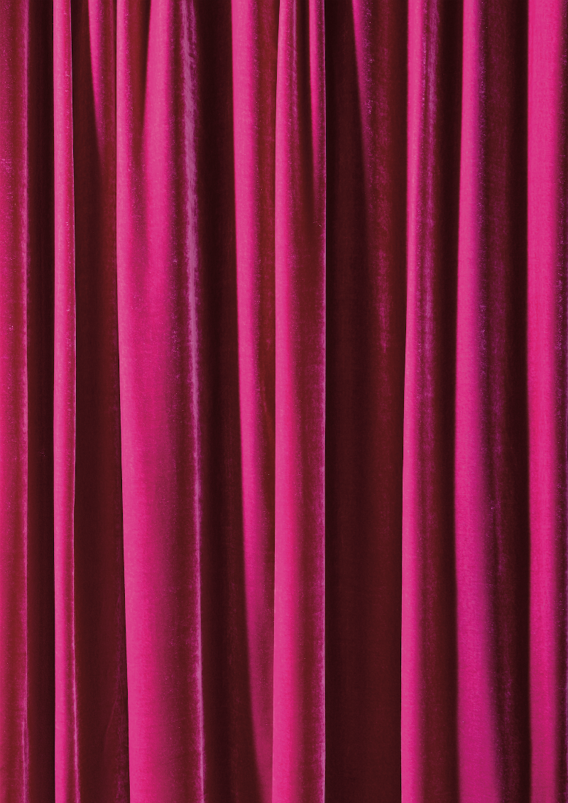 A vibrant pink curtain effect vinyl photography backdrop, ideal for beauty product photography and cosmetic shoots.
