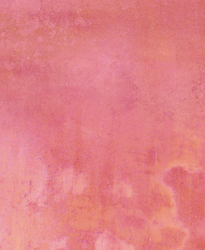 A multicolored vinyl photography backdrop with shades of pink, peach, and orange creating a vibrant gradient effect.