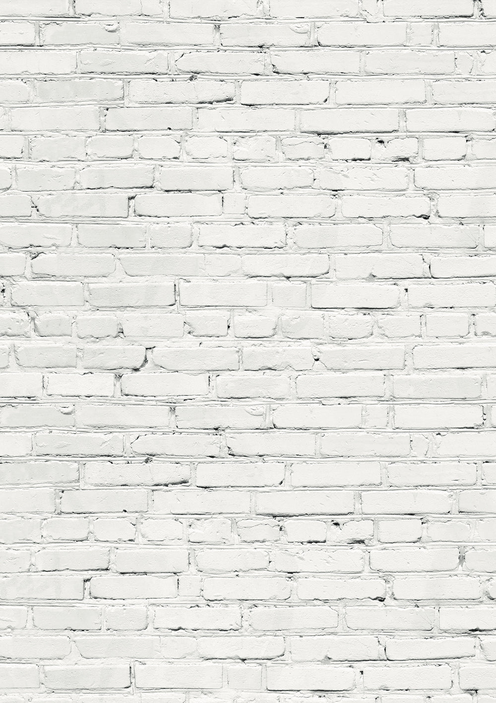 A white brick wall effect vinyl photography backdrop with varying shades of grey and mortar lines designed to mimic a brick wall texture.