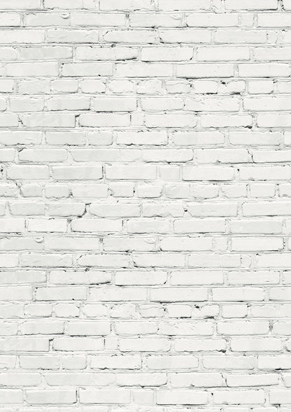 A white brick wall effect vinyl photography backdrop with varying shades of grey and mortar lines designed to mimic a brick wall texture.