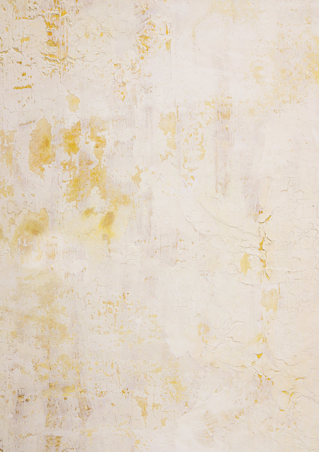 A crackled yellow paint effect photography backdrop with flaky texture revealing strong yellows under a buttery top.