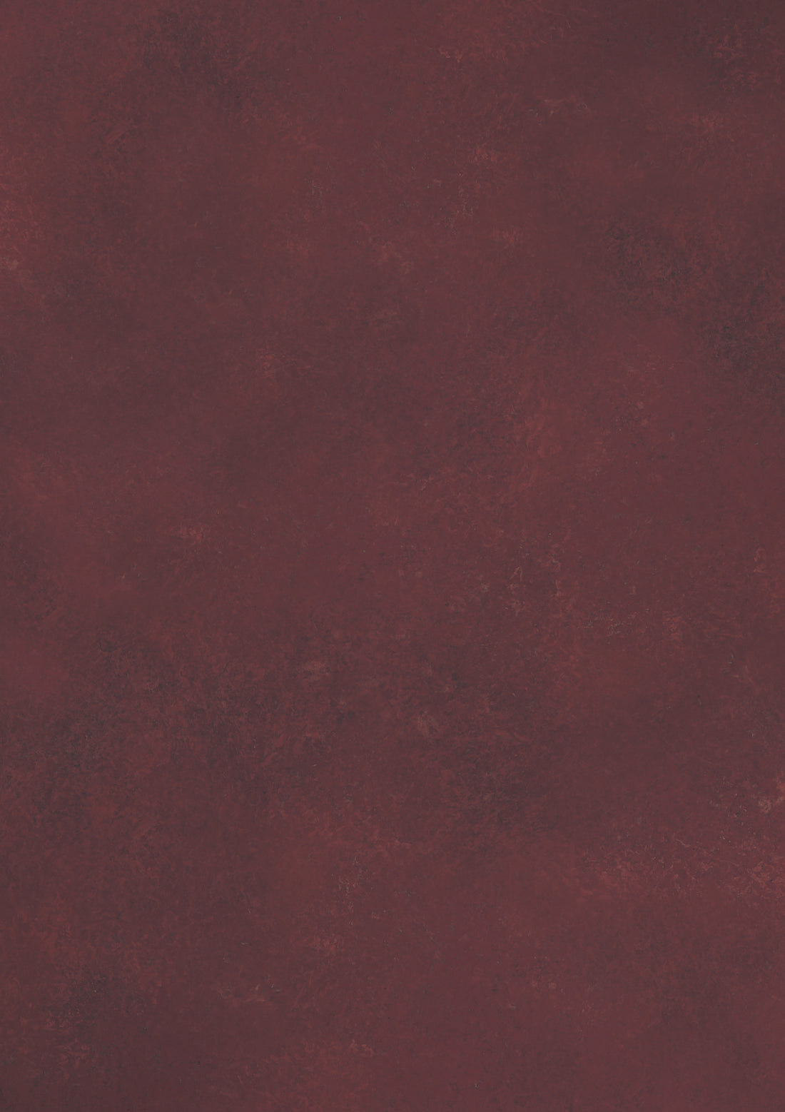 A close-up of a deep red vinyl photography backdrop used in food styling and product photography.