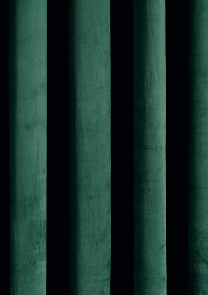 A close-up view of a green velvet curtain-effect vinyl photography backdrop.