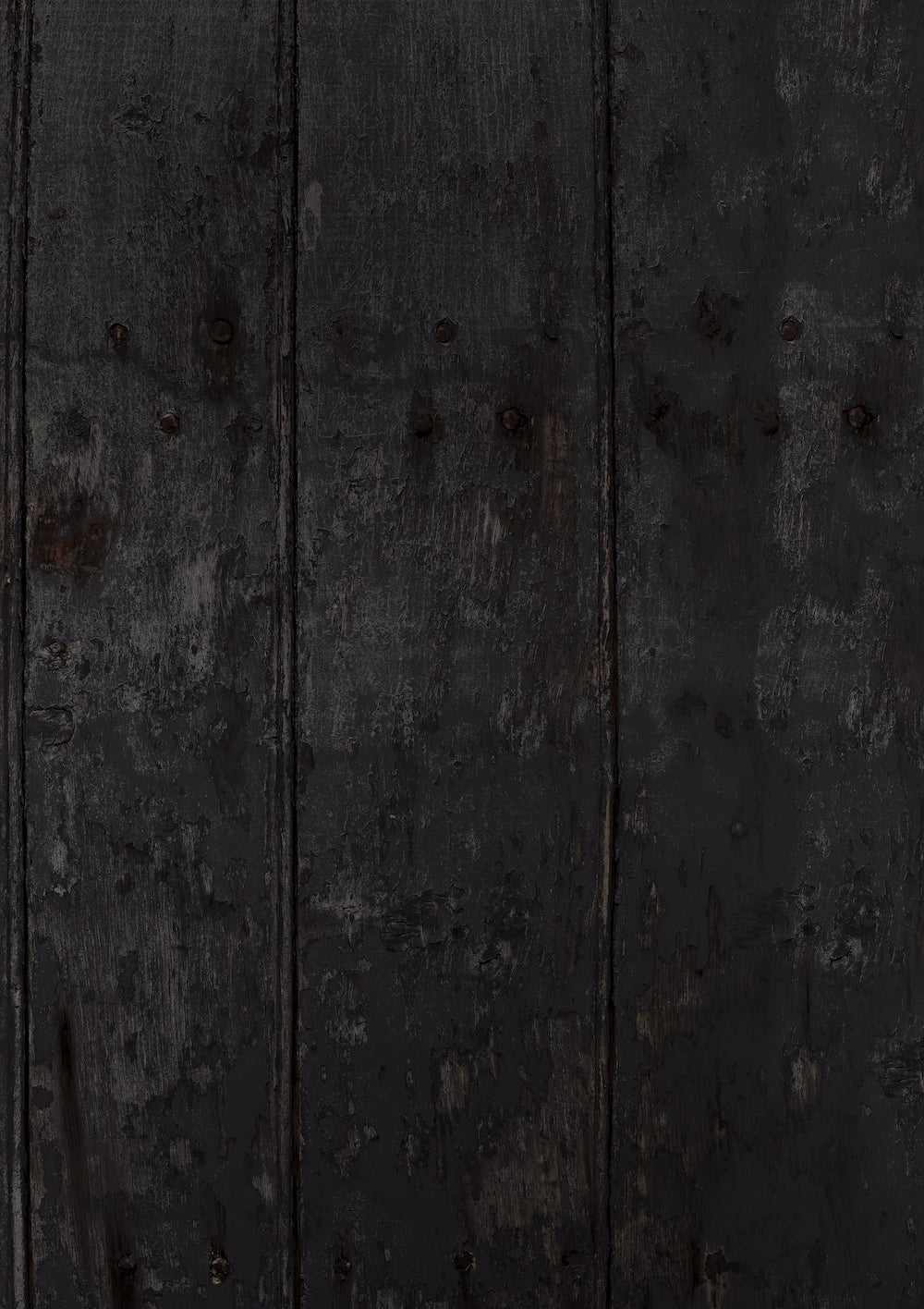 A close-up view of a vinyl photography backdrop depicting an old wood panel effect in dark grey and black tones