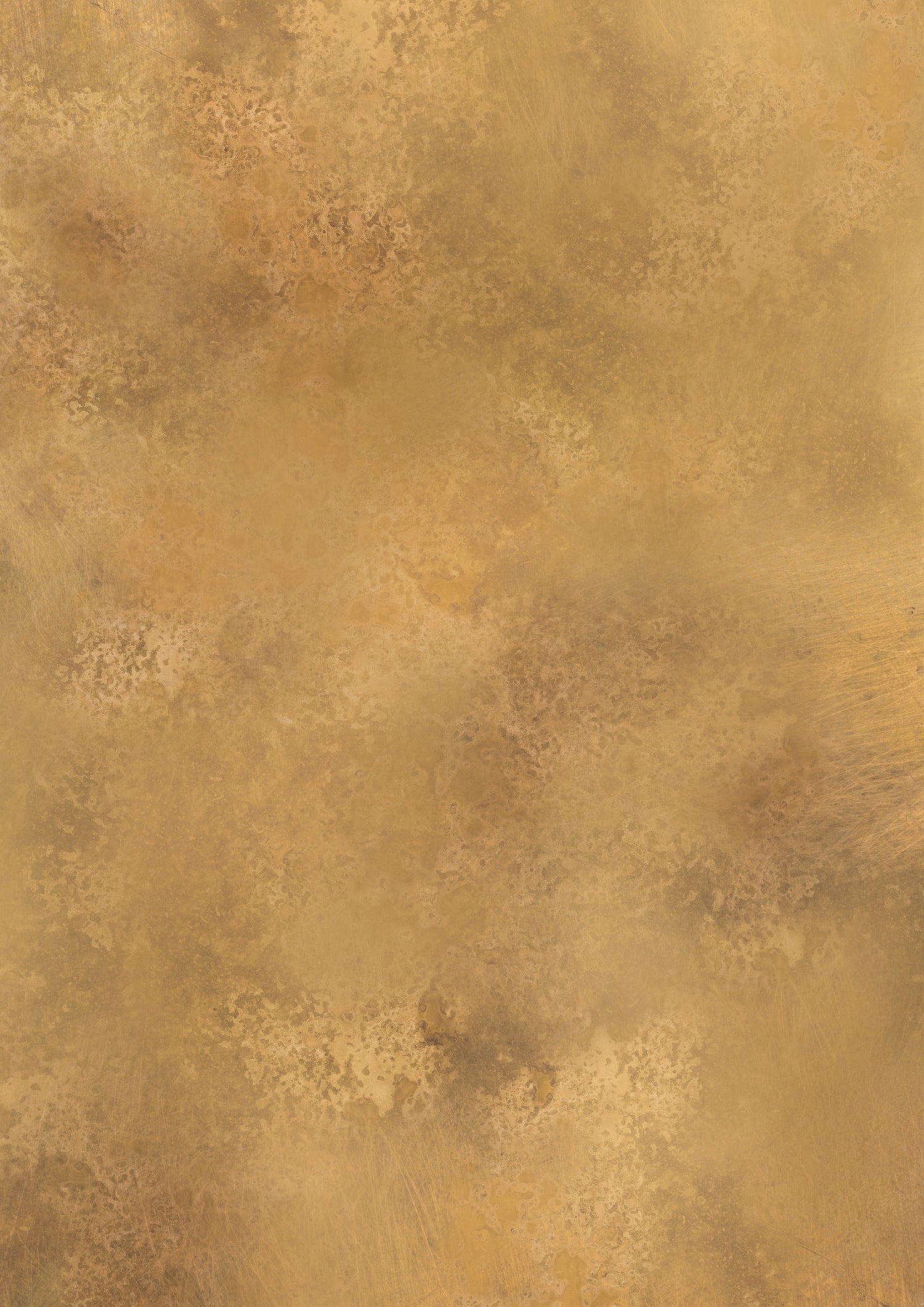 A golden brass metal effect photography backdrop with a softly mottled texture.