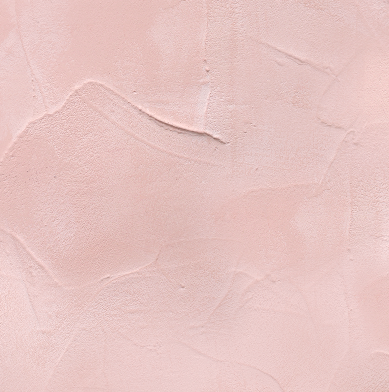 Close up of a hand-trowelled soft blush pink plaster effect vinyl photography backdrop for food, jewellery and still life photography