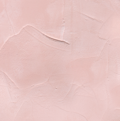 Close up of a hand-trowelled soft blush pink plaster effect vinyl photography backdrop for food, jewellery and still life photography