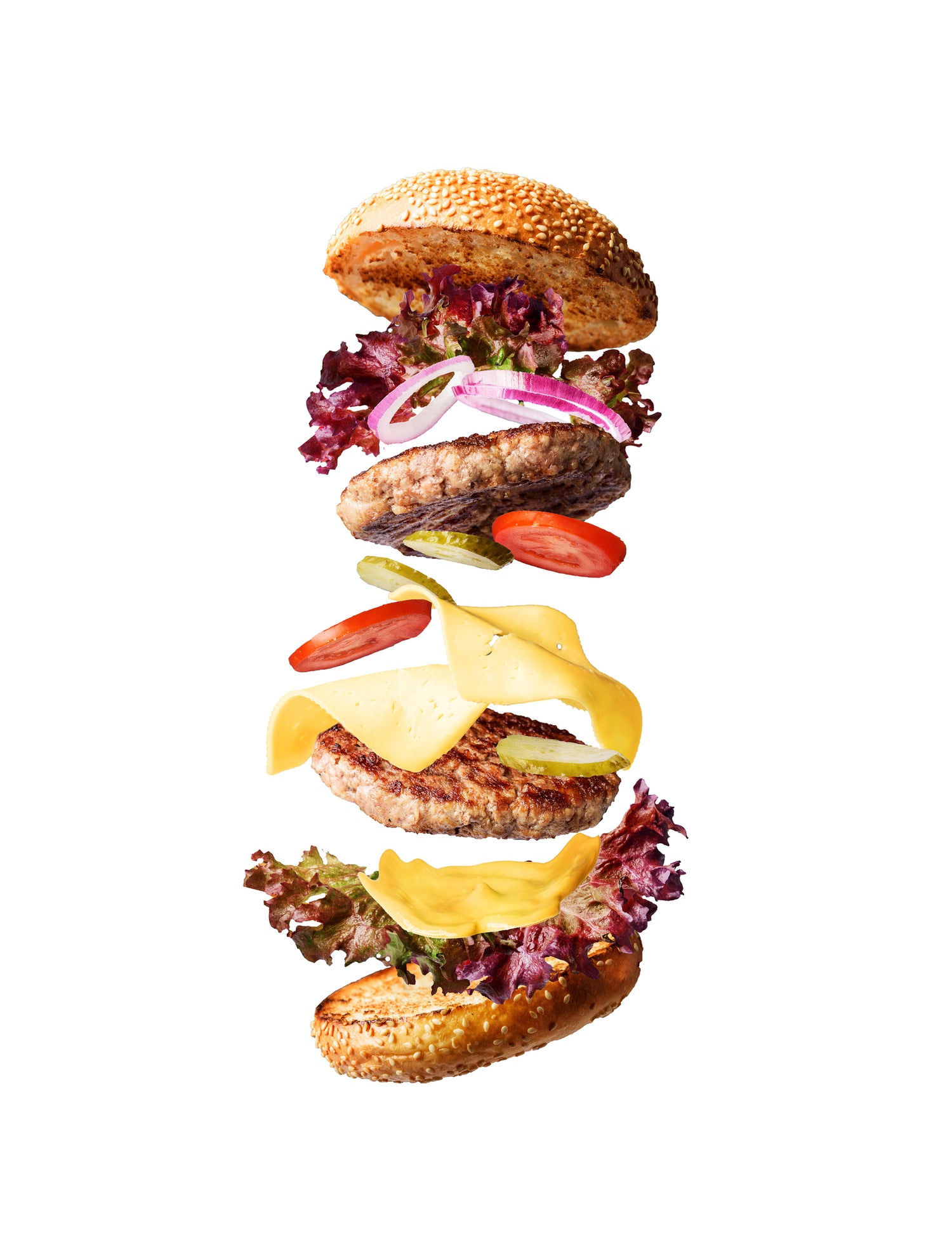 A deconstructed burger styled on a plain white photography backdrop designed for use in studio and ecommerce commercial photography.