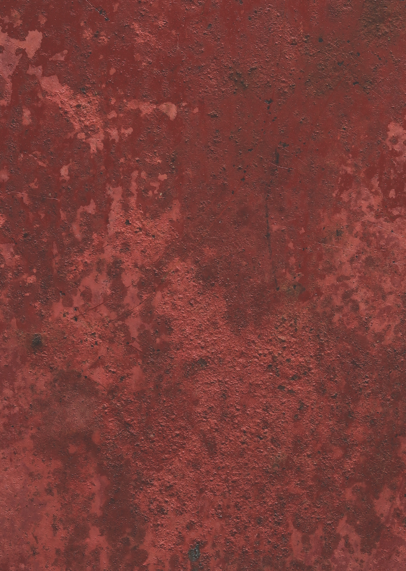 A close-up image of a textured rusty red metal effect photography backdrop used for food and product styling.