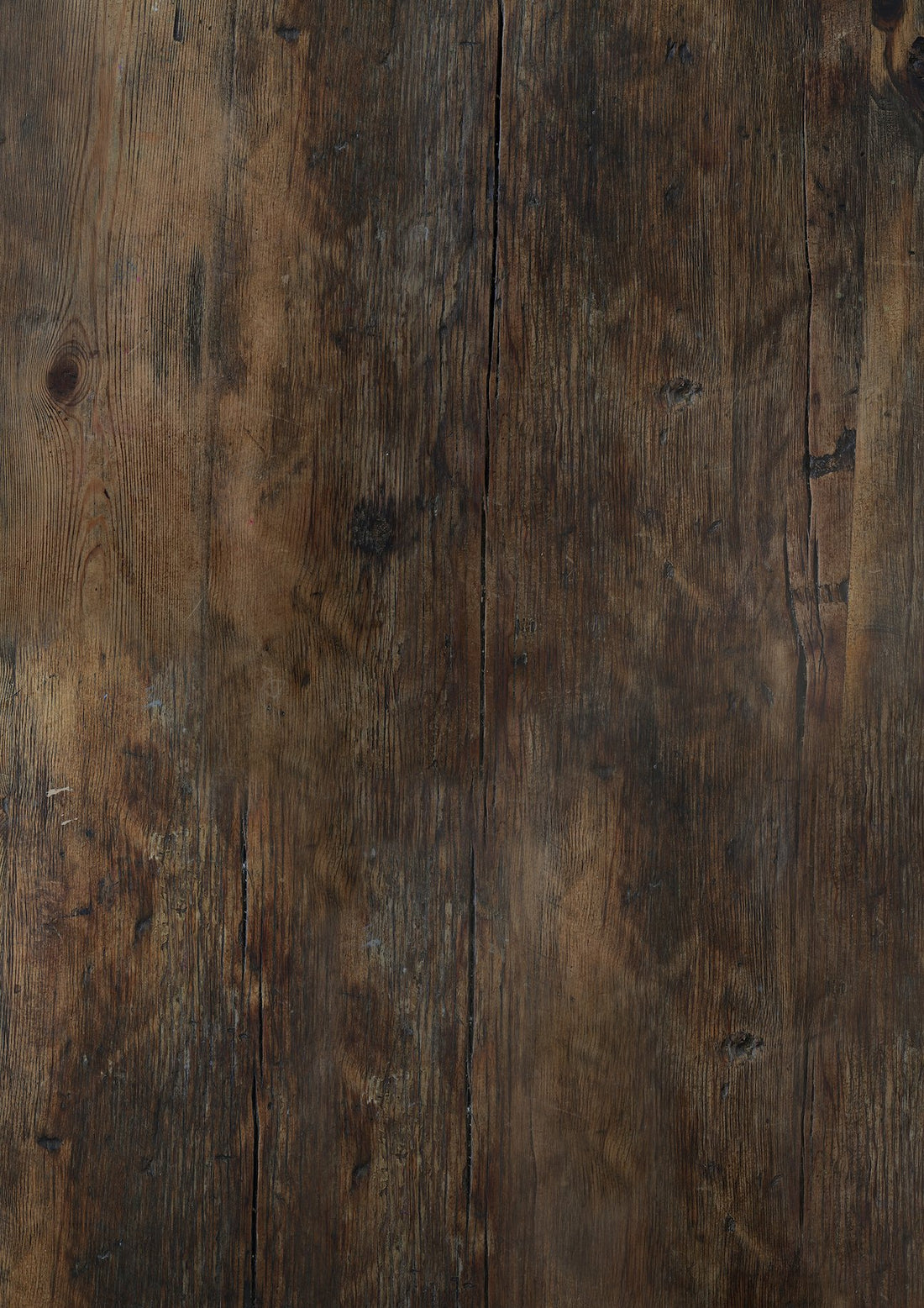 A close-up image of a dark, old wood photography backdrop with visible grain and natural patterns.