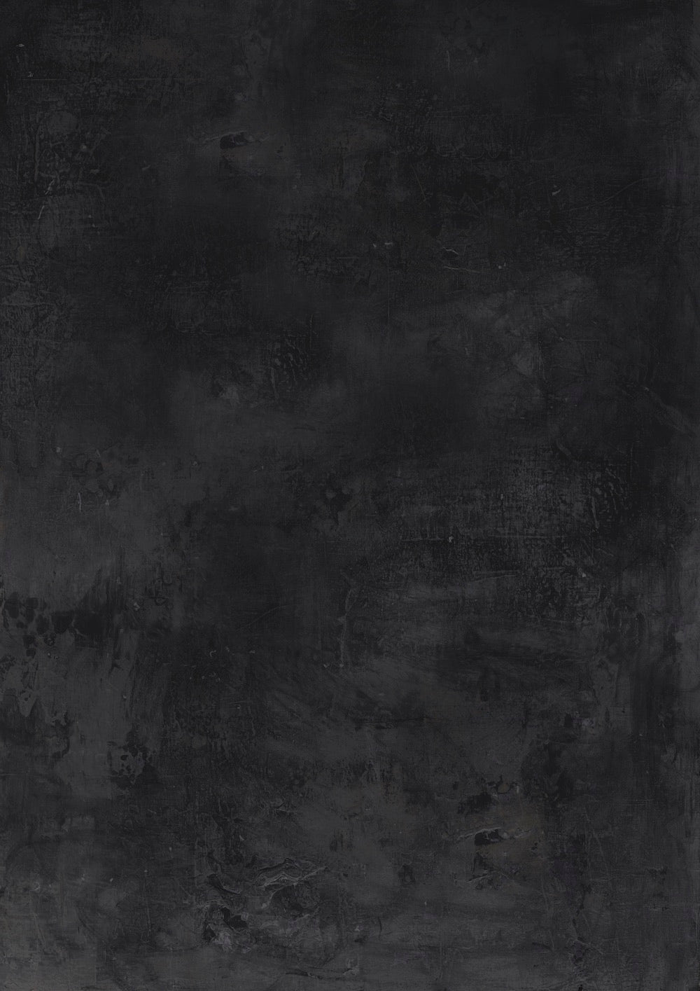 A hand-painted black photography backdrop with a subtle slate-like texture.