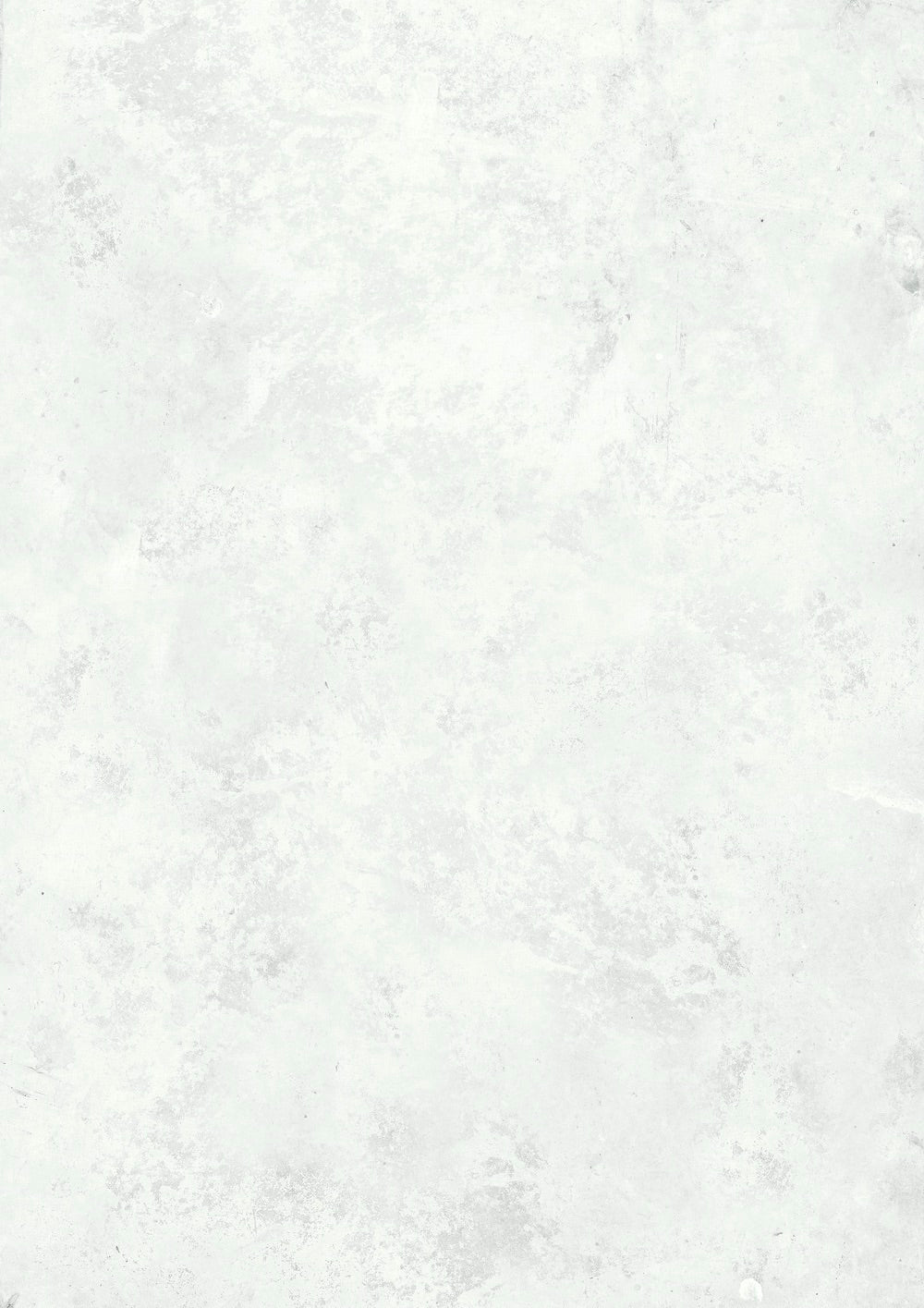 A close-up view of a mottled white effect photography backdrop with a subtle pattern.