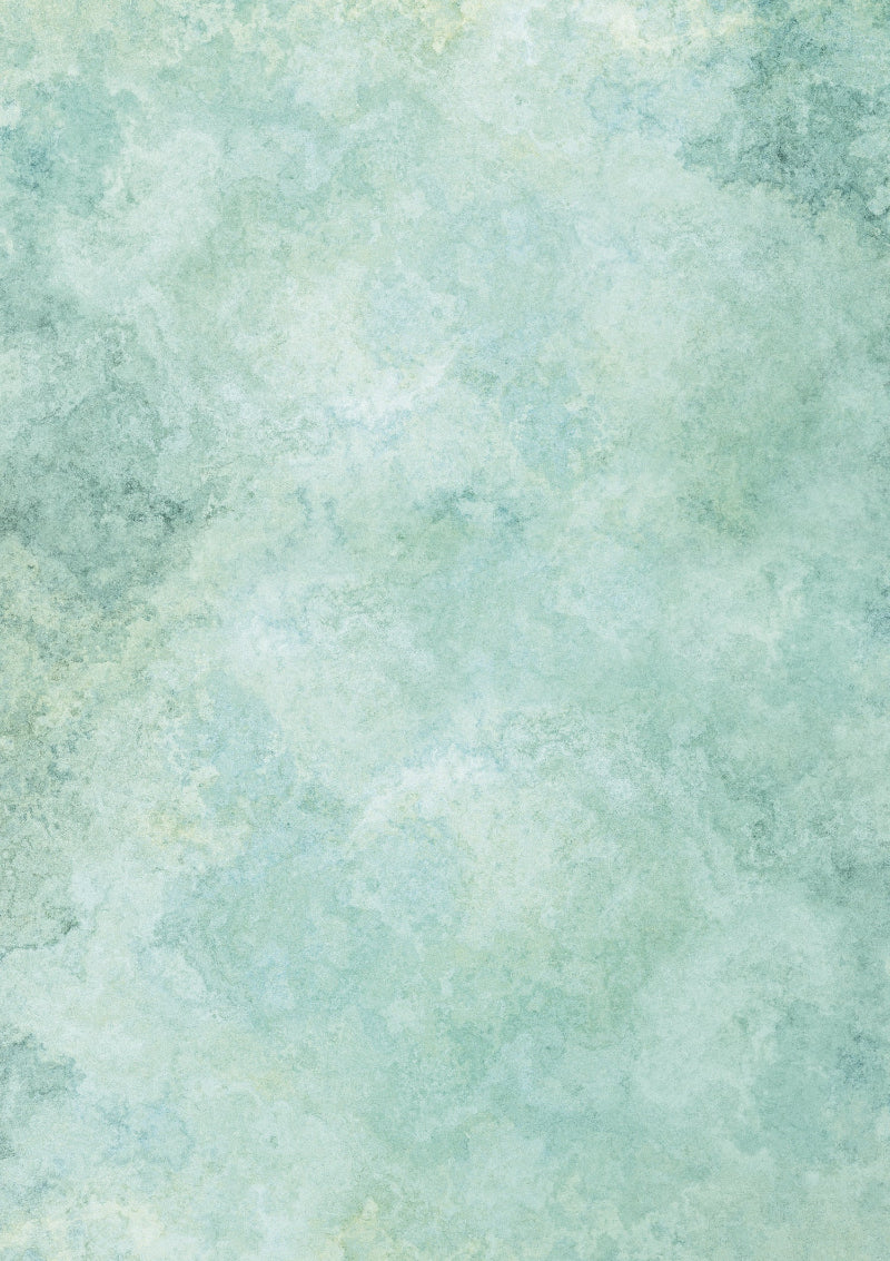 A green mottled marble-effect photography backdrop with shades ranging from soft sage to fresh mint.