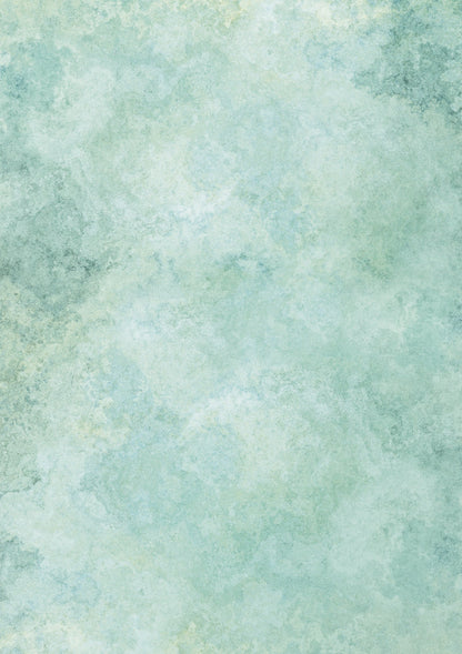 A green mottled marble-effect photography backdrop with shades ranging from soft sage to fresh mint.
